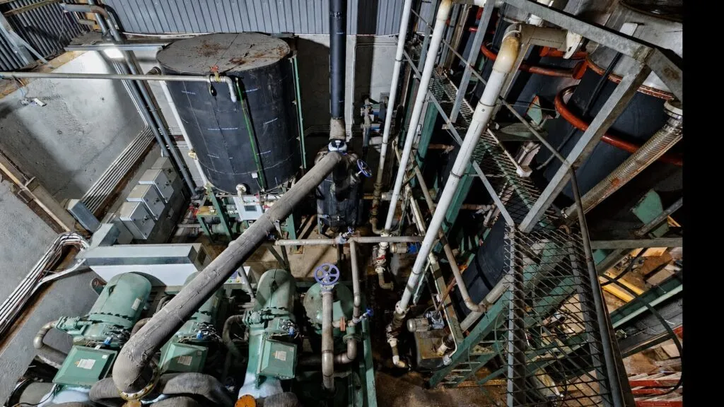 Overhead view of refrigeration equipment, vessels and pipework in a Sheung Shui tube-ice plant