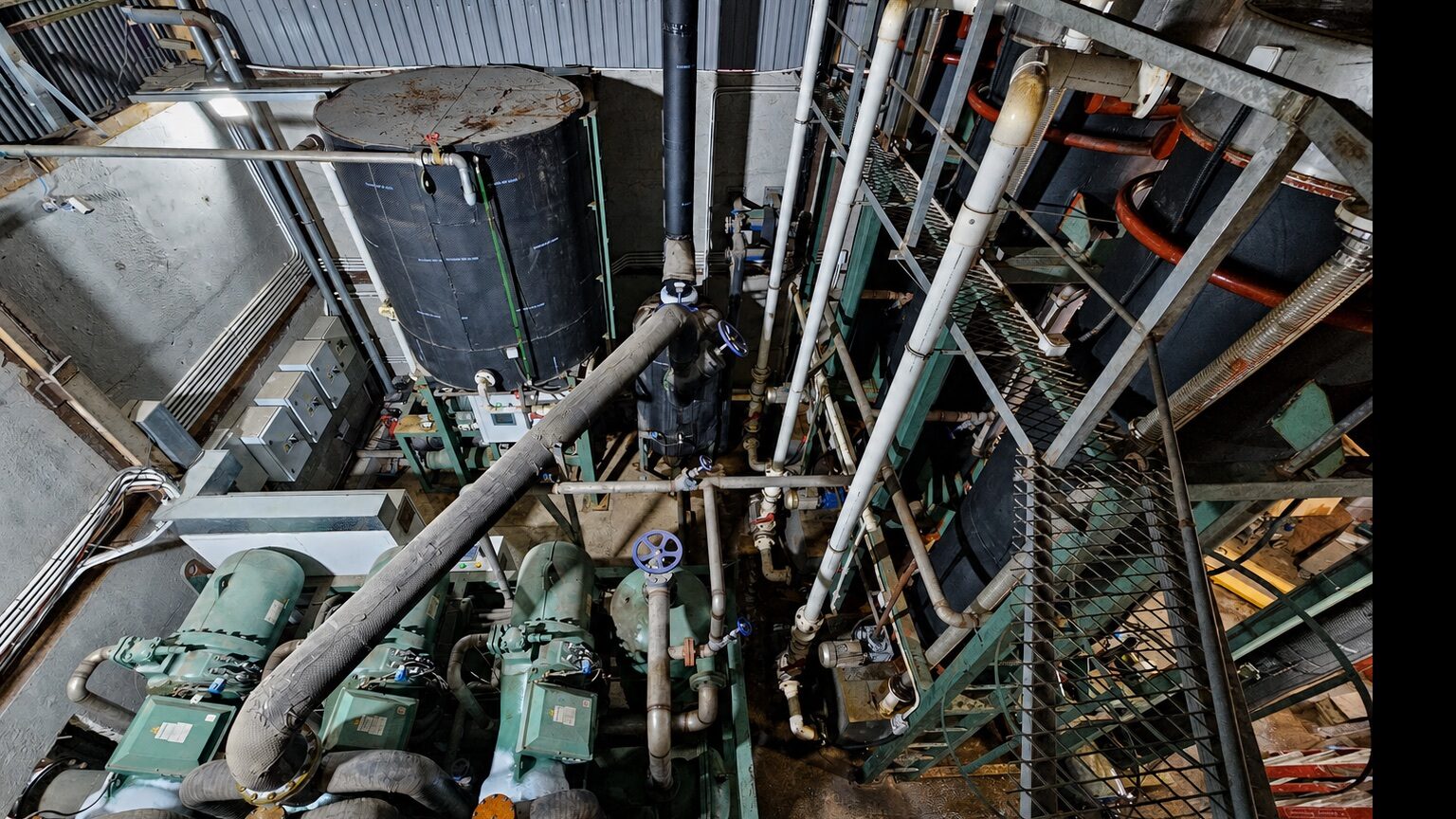 Overhead view of refrigeration equipment, vessels and pipework in a Sheung Shui tube-ice plant