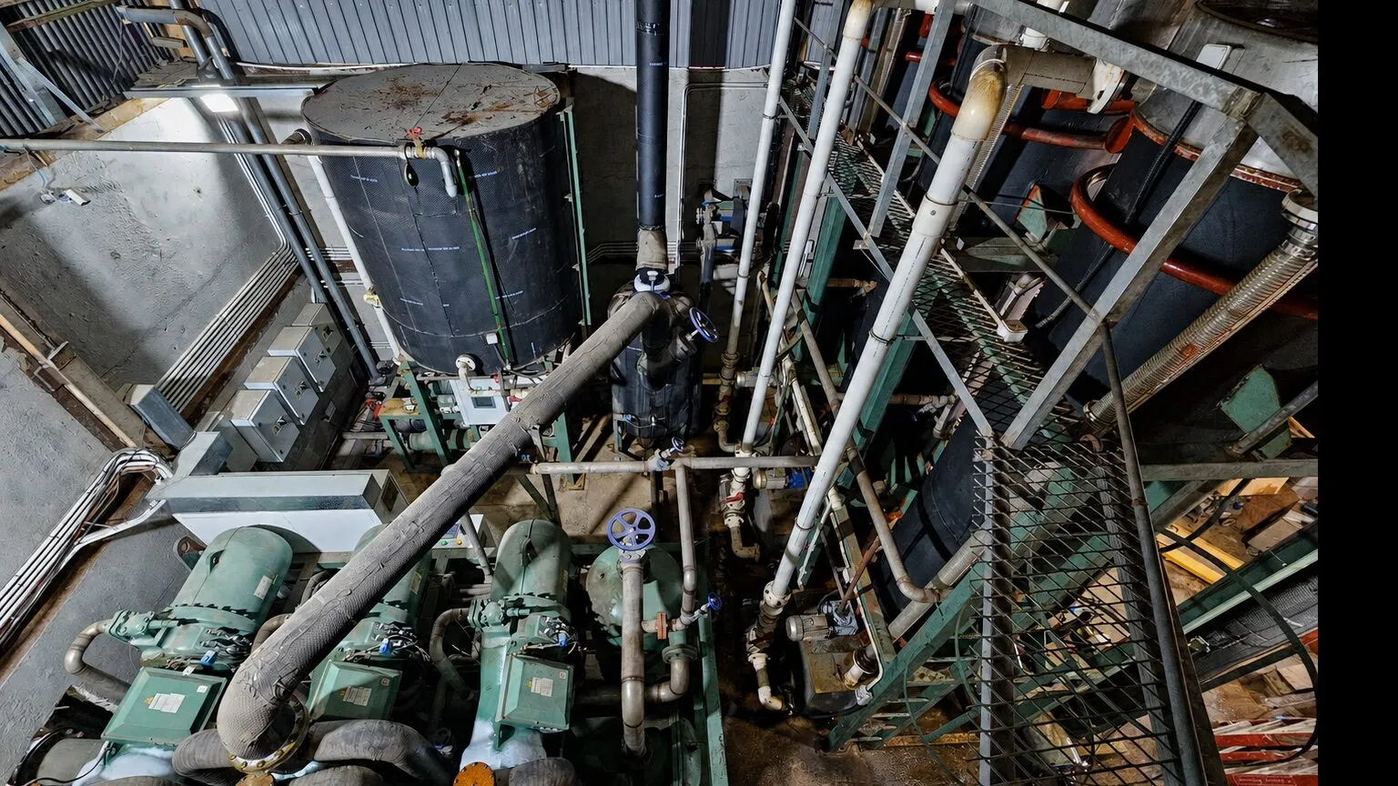 Overhead view of refrigeration equipment, vessels and pipework in a Sheung Shui tube-ice plant