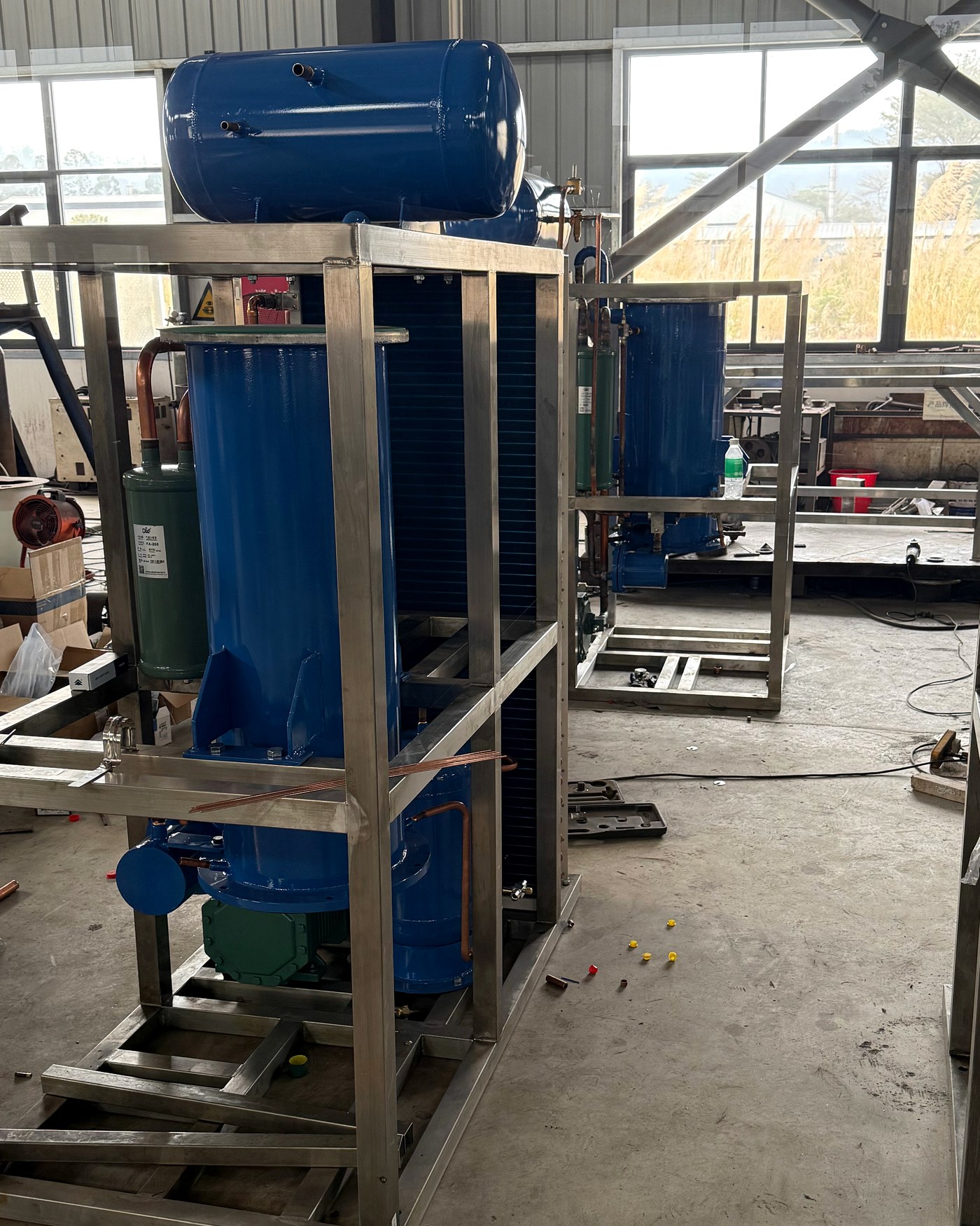 Tube ice machine refrigeration unit and stainless-steel frame during factory assembly.