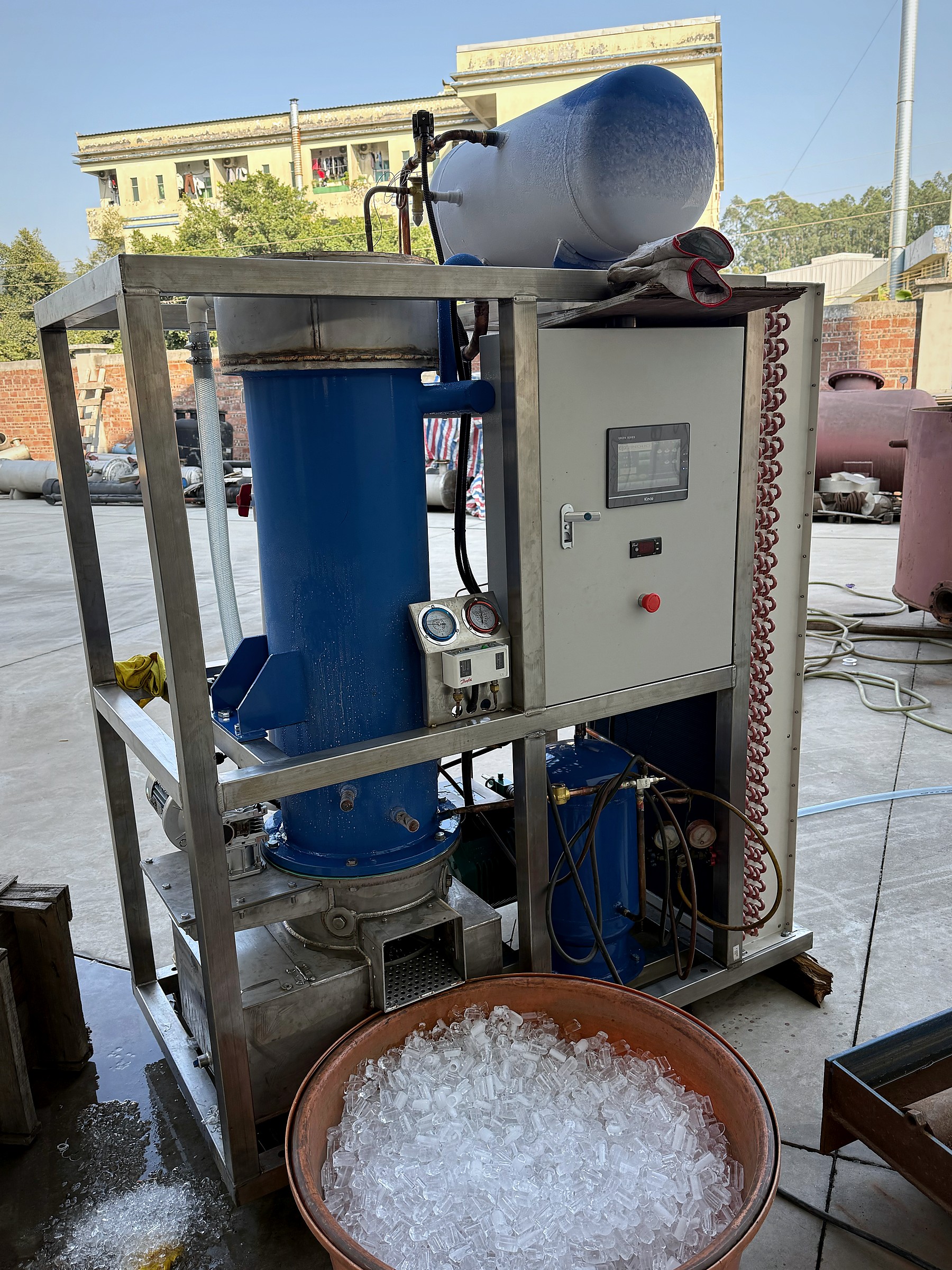 Tube ice machine producing and collecting actual tube ice during a factory operating run.